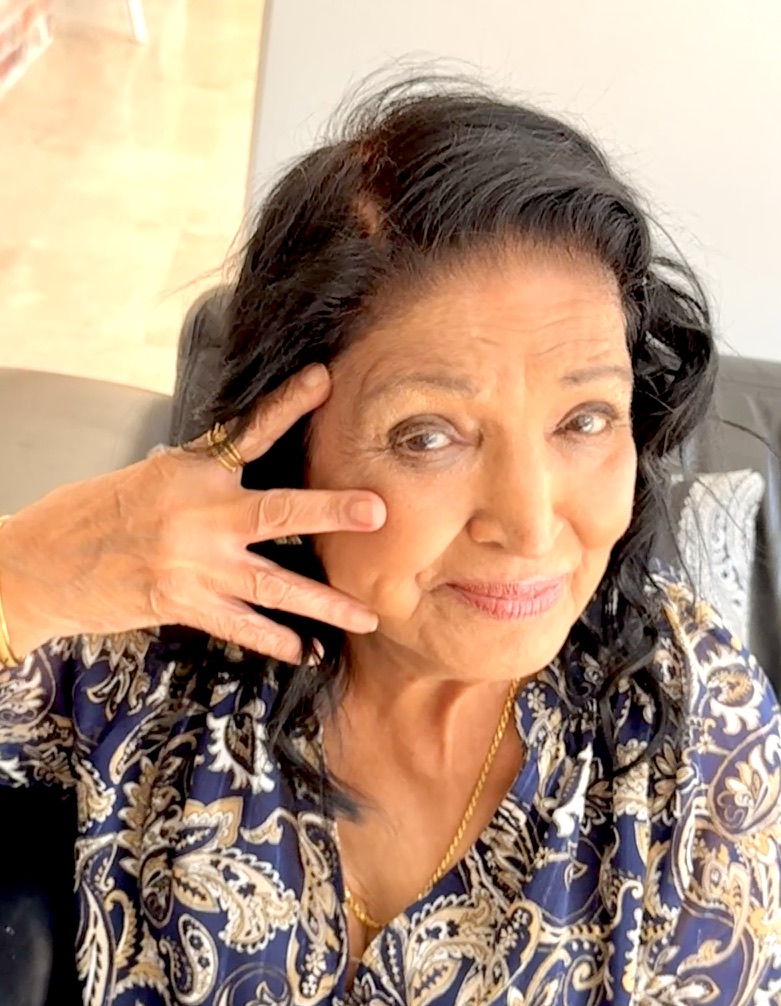 Savita Prem showing three fingers for the TNA UK Show TN 3 Fingers campaign for International Trigeminal Neuralgia Day 2026