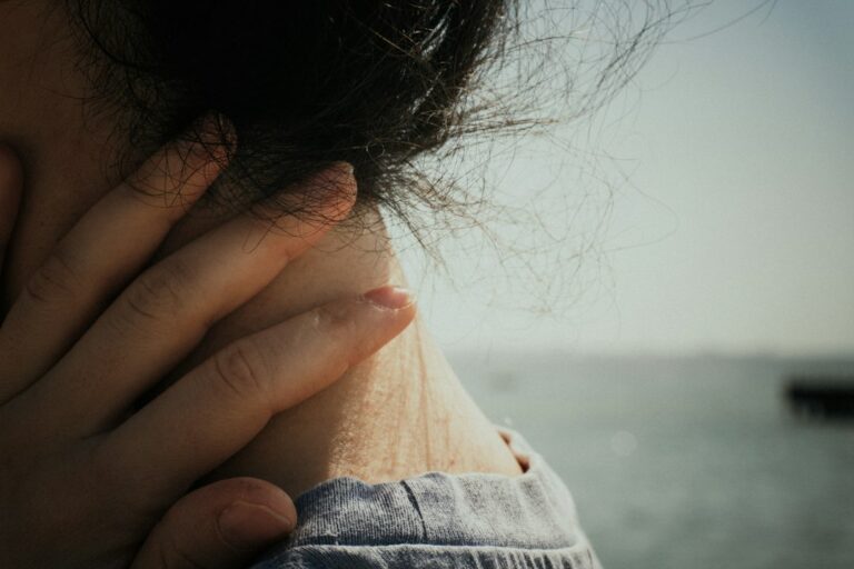Hand resting on the side of the neck